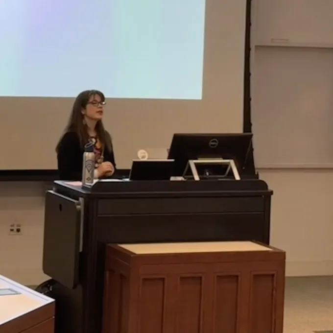 two professors standing in front of an audience